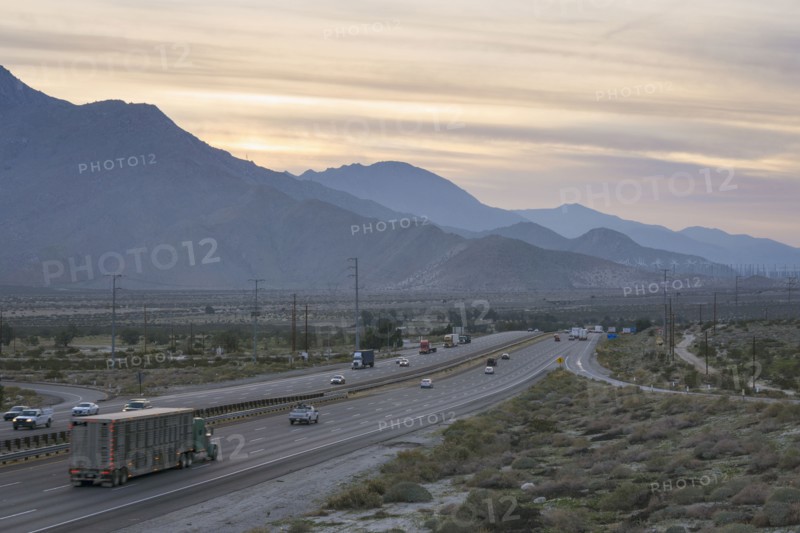 I-10 highway along mountains at sunset