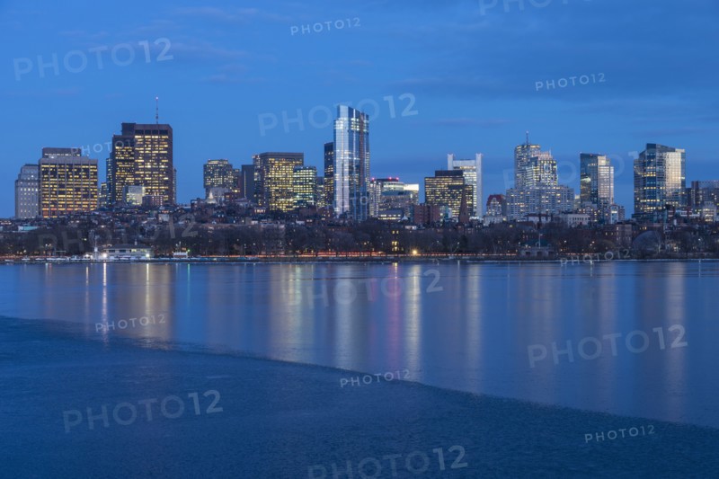 Charles river and illuminated downtown district at dusk