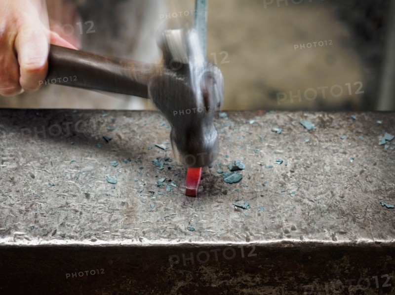 Close up of hand of female blacksmith with hammer