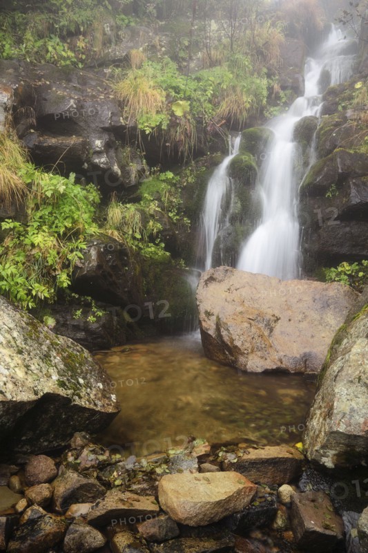 Dzembronskie waterfalls among rocks