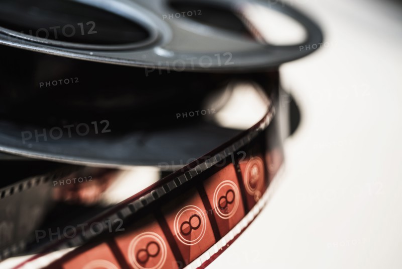 Close-up of film reel on white background.
