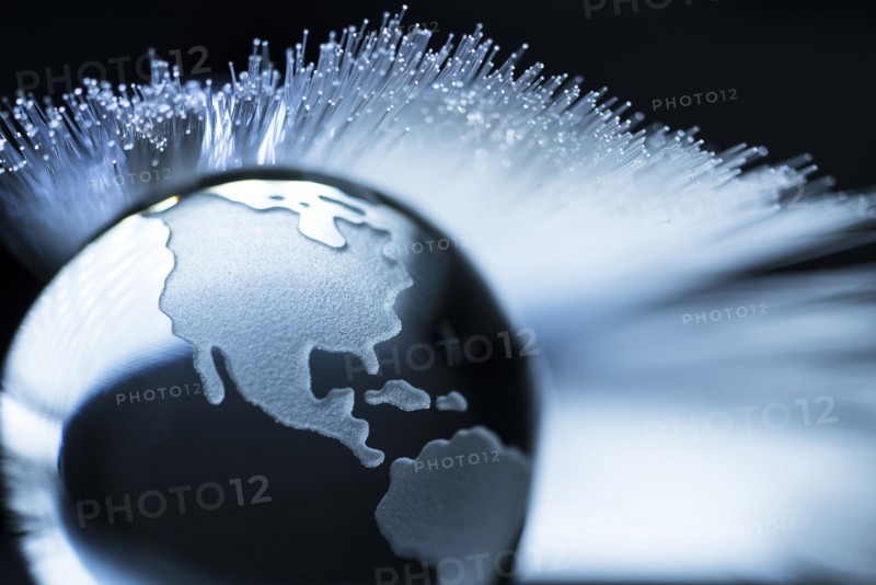 Illustration of fiber optics over globe.