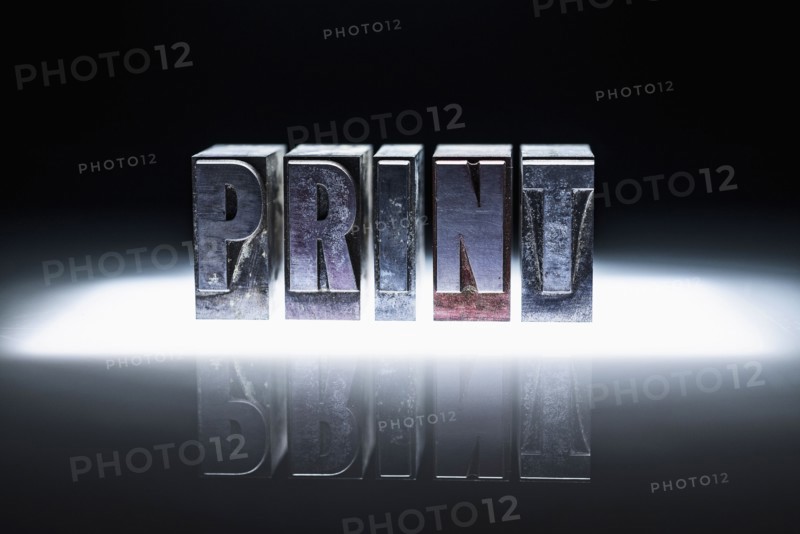 Word "PRINT" carved in blocks.
