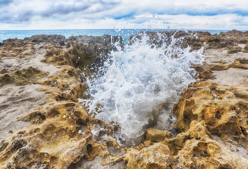 Wave splashing on rock formation