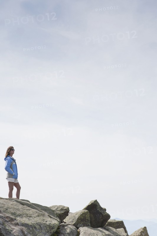 Woman standing on rocks