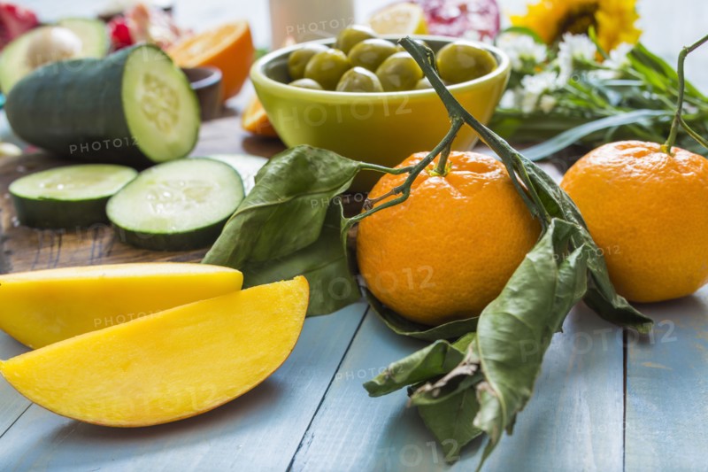 Fresh mangoes and oranges