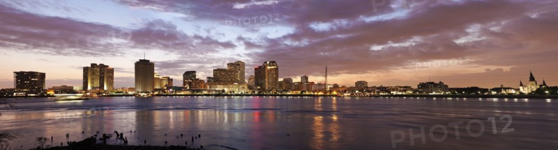 Louisiana, New Orleans, Mississippi river and city skyline with skyscrapers at sunset