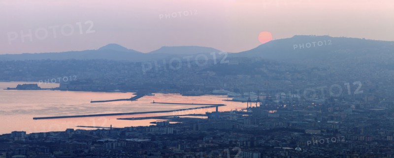 Italy, Campania, Naples, Panorama of city at sunrise