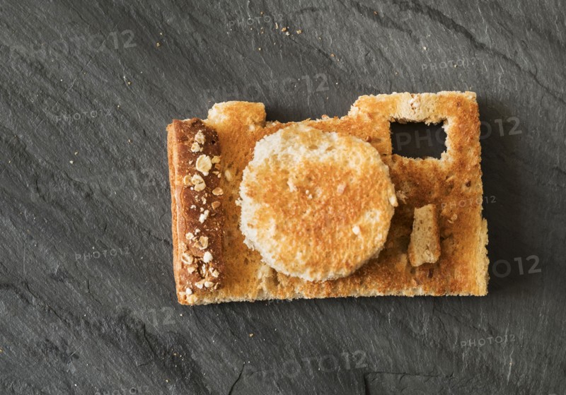 Camera shaped toast bread on table.