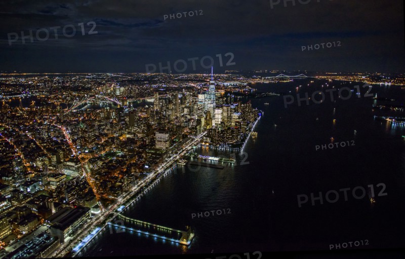 USA, New York, New York City, Aerial view of illuminated skyline at night.