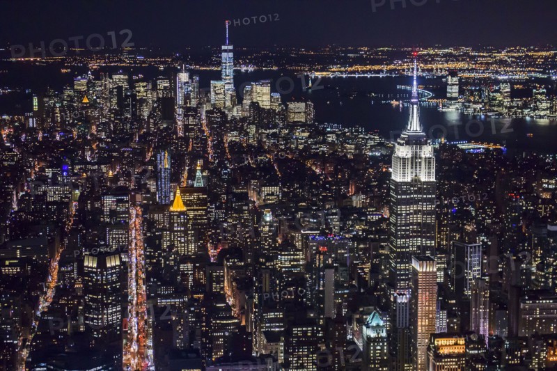 USA, New York, New York City, Manhattan, Aerial view of illuminated skyline at night.