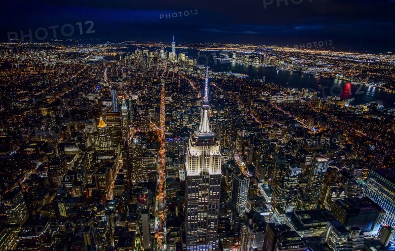 USA, New York, New York City, Manhattan, Aerial view of illuminated skyline at night.