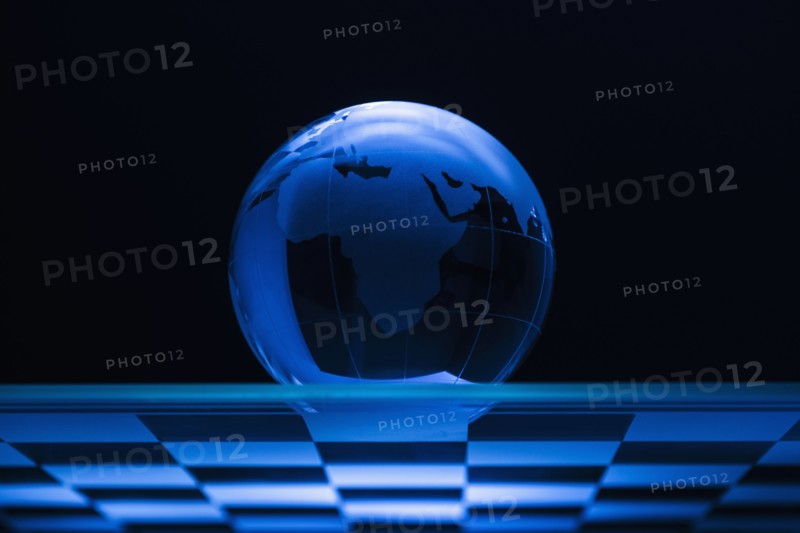Globe on chess board.