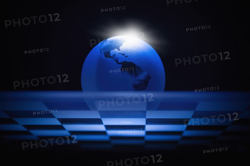 Globe on chess board.
