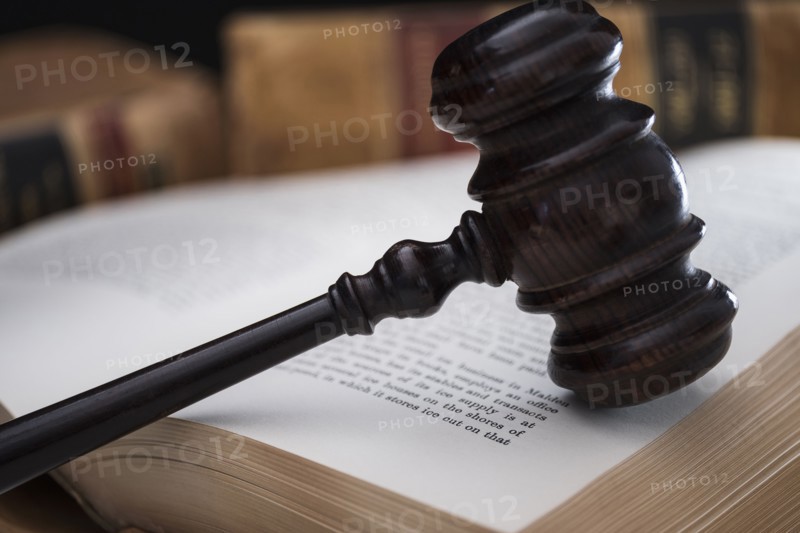 Gavel on open law book.