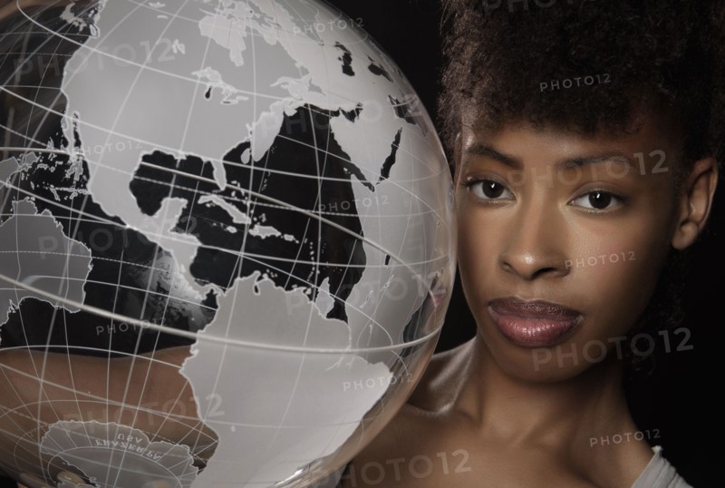 Young woman with transparent globe.