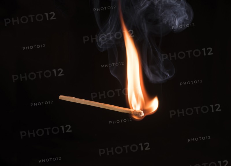 Studio shot of burning match.