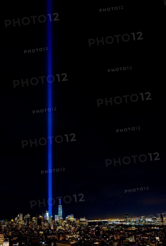 USA, New York State, New York City, Cityscape with light beam over ground zero.