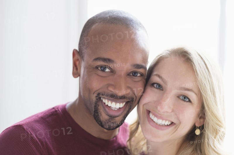Portrait of happy multi ethnic couple.