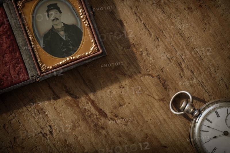 Antique photograph and pocket watch.