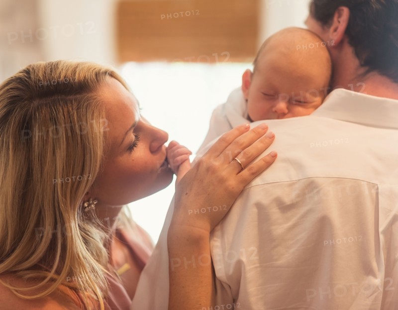 Couple with baby son (0-1 months)