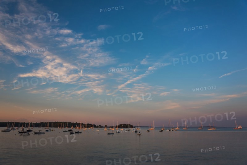 USA, Maine, Camden, Sailboats at sunset
