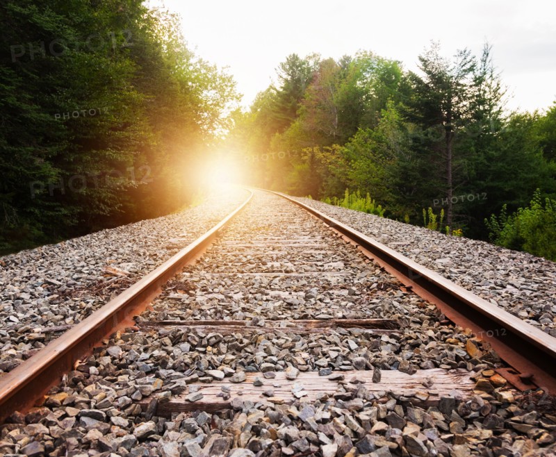 USA, Maine, Knox, Railroad track at sunset