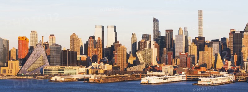 USA, New York State, New York City, Waterfront skyline at sunrise