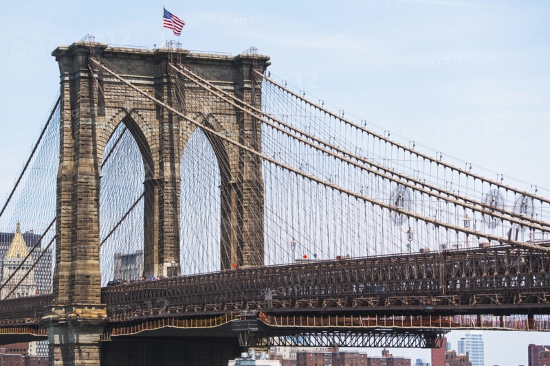 USA, New York State, New York City, Brooklyn Bridge with American flag on top
