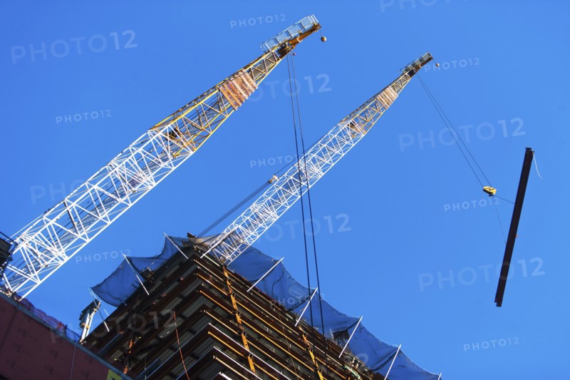 USA, New York State, New York City, Manhattan, Low angle view of cranes on construction site