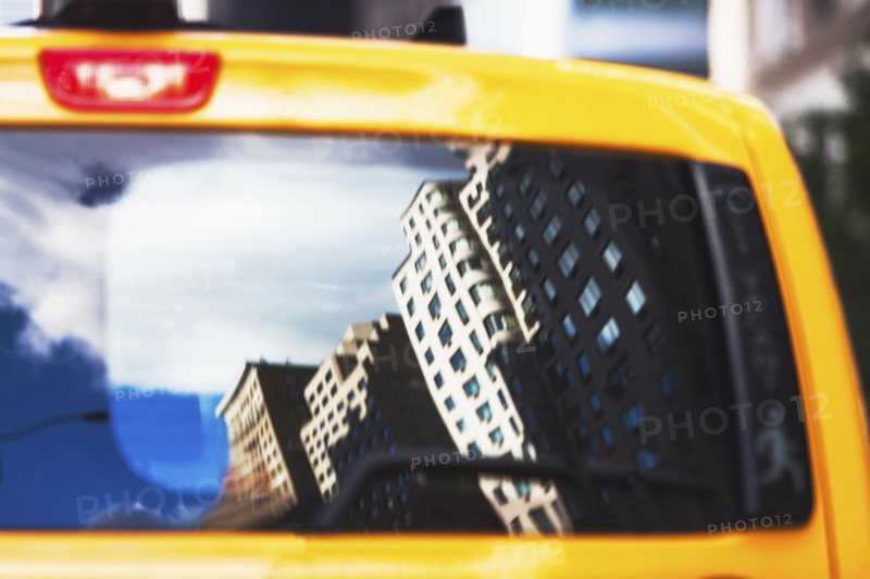 USA, New York State, New York City, Manhattan, Townhouses reflecting in cab's window