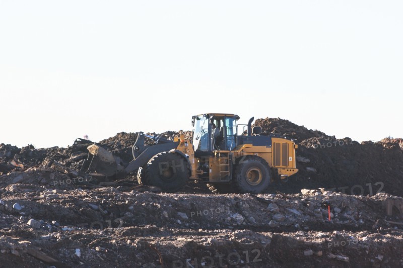 USA, New York State, New York City, Bulldozer on garbage dump