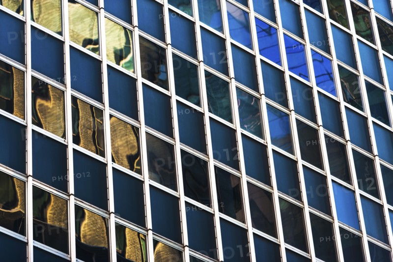 USA, New York, New York City, Glass facade of office building