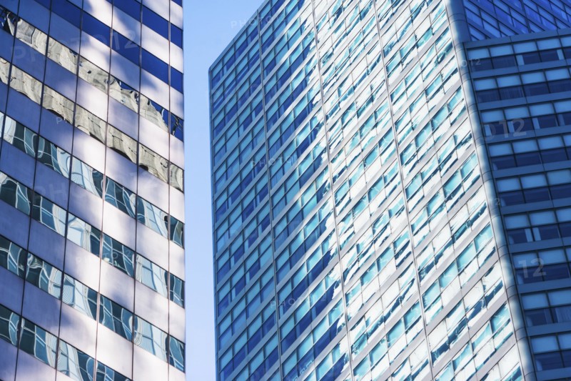 USA, New York, New York City, Glass facade of office buildings