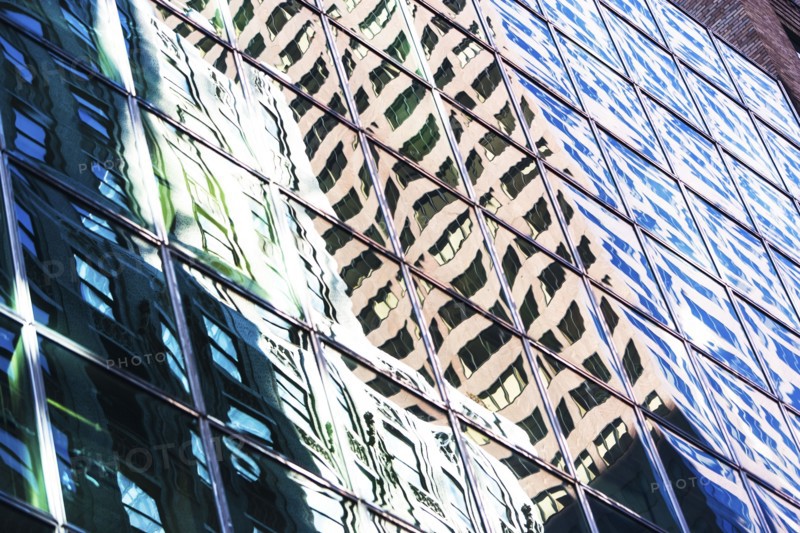 USA, New York City, Glass facade of office building