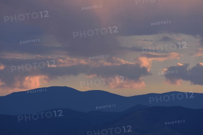 USA, Colorado, Denver, Colorful evening sky over mountain range