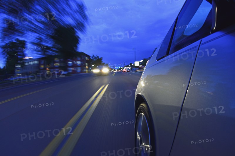 USA, Colorado, Denver, Car on city street at dusk