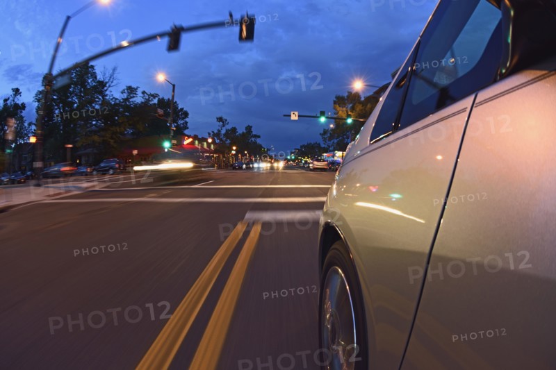 USA, Colorado, Denver, Car on city street at dusk