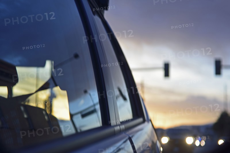 Reflections of city traffic in car's window