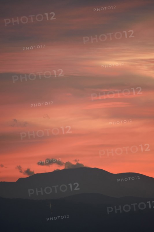 USA, Colorado, Denver, Colorful sky over mountain range