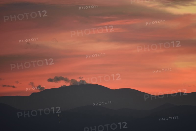 USA, Colorado, Denver, Colorful sky over mountain range