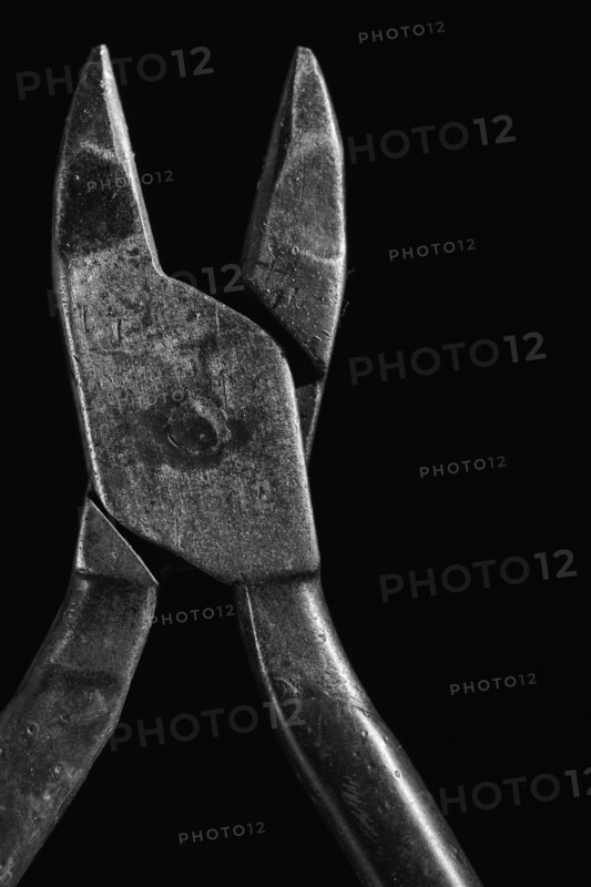 Hand tool against black background