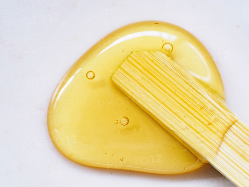 Honey and wooden stick