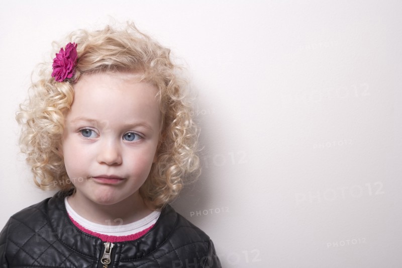 Portrait of blonde girl (4-5) on white background
