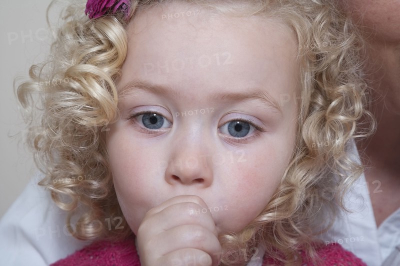 Portrait of girl (4-5) sucking thumb