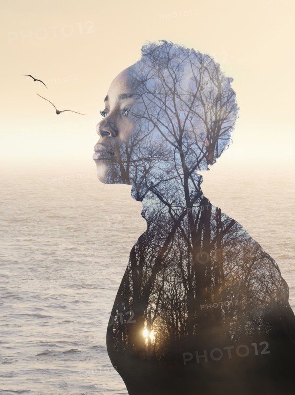 Composite image of woman, forest and seascape.