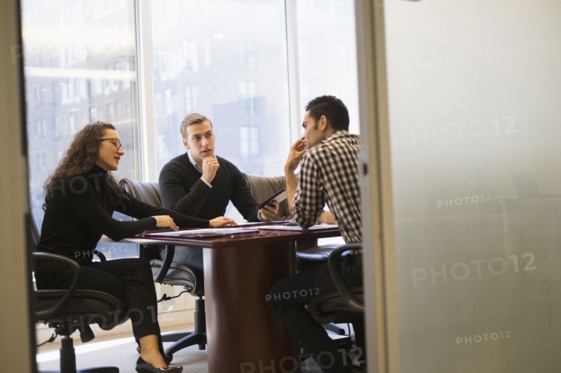 Young business people having meeting in conference room.