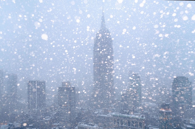 USA, New York State, New York City, Empire State Building and city skyline in snow.