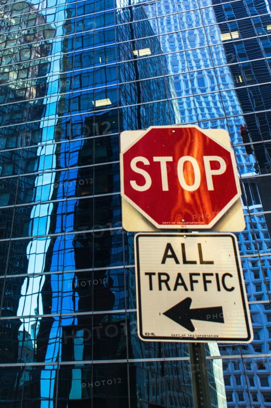 USA, New York, Distorted reflections in office building and stop sign in front