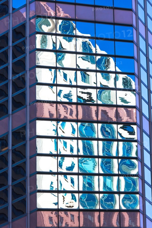 USA, New York, Distorted reflections in Glass building